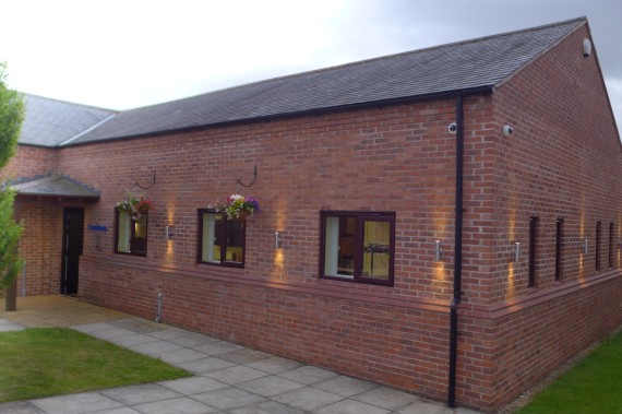 Our new home, finished from the outside with illumination and hanging baskets